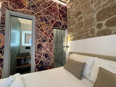 a small bedroom with a bed and a window at Hotel Felice in Rome