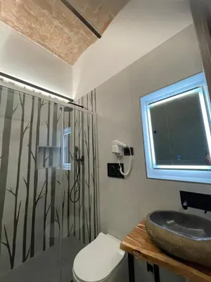 a hotel room with a bed and a mirror at Hotel Felice in Rome