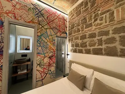 a hotel room with a bed with towels on it at Hotel Felice in Rome