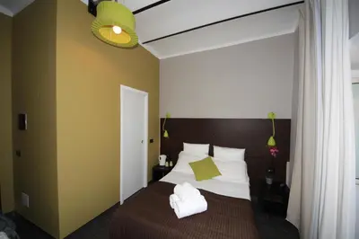 a bathroom with a toilet and a sink and a shower at Hotel Felice in Rome
