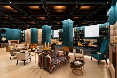 a lobby with couches and chairs in a store at Sina Bernini Bristol, Autograph Collection in Rome