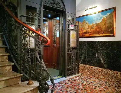 a entrance to a building with a staircase and a door at Hotel Montecarlo in Rome