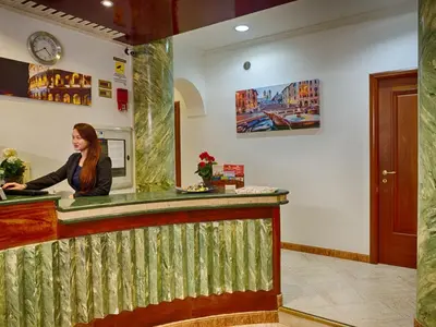 a woman standing at the counter of a restaurant at Sunny Guest House in Rome