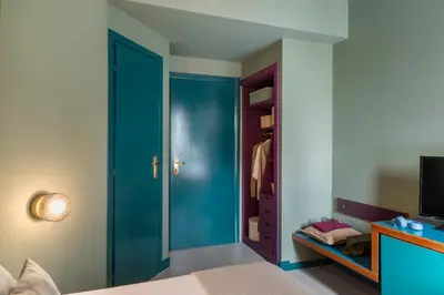 a bathroom with a mirror and a shower curtain at Hotel Milani in Rome