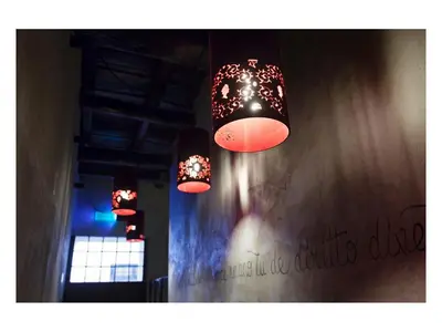 three lights hanging from a wall in a room at Casa de' Coronari in Rome