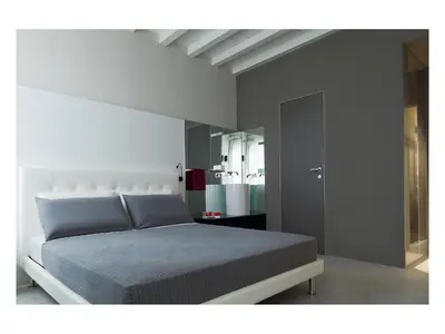 a bedroom with a bed and a mirror at Casa de' Coronari in Rome