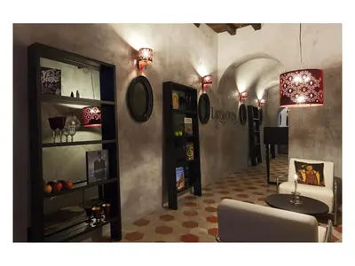 a living room with a table and a chair at Casa de' Coronari in Rome