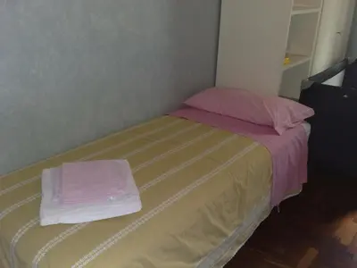 a small bed with two towels on top of it at Amici di Roma in Rome