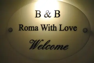 a sign with the words roma with love welcome at B&B Rome With Love in Rome