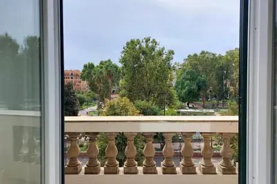 a window with a view of a park at Lucky Stars rooms in Rome