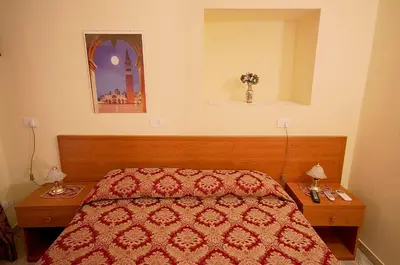 a bedroom with a bed with two nightstands and a bed sidx sidx sidx at Parioli House in Rome