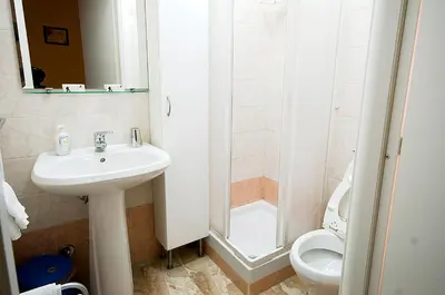 a bathroom with a sink and a toilet at Parioli House in Rome