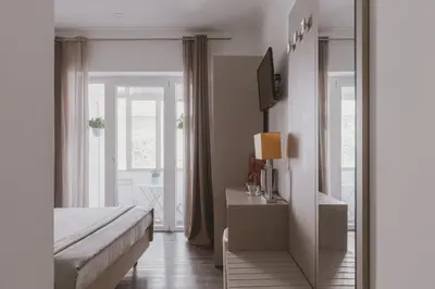 a bedroom with a bed and a tv and a window at Residenza Il Duca in Rome