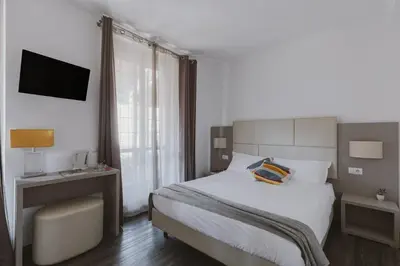 a hotel room with a bed and a television at Residenza Il Duca in Rome