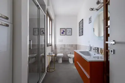 a bathroom with a sink and a toilet and a shower at Radio Hotel in Rome