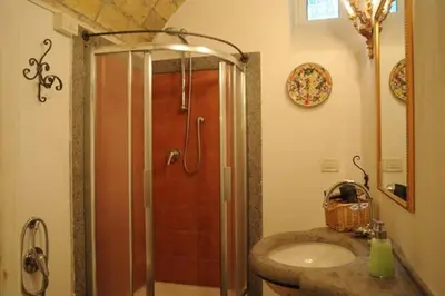 a bathroom with a shower with a sink and a shower at Villino Corbelli B&B in Rome