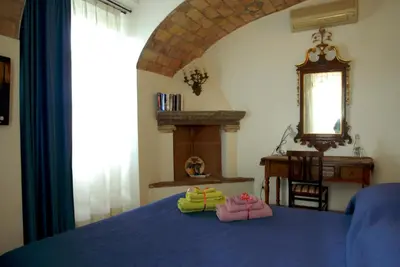a bedroom with a bed with two towels on it at Villino Corbelli B&B in Rome