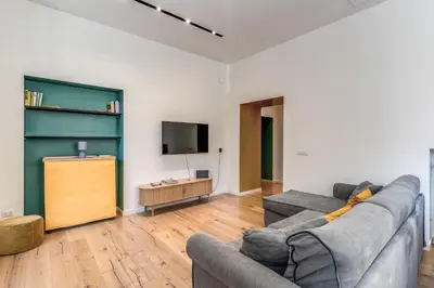 a living room with a couch and a tv at Domus in Piazza del Popolo in Rome