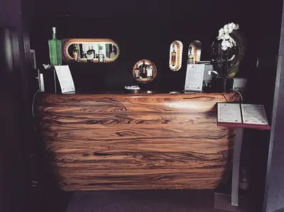 a dressing room with a wooden counter and a mirror at Black Hotel in Rome