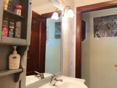 a bathroom with a sink and a mirror at Hostel Cosmos in Rome