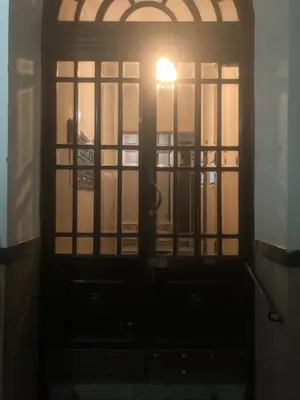 an open door with a light shining through it at Hostel Cosmos in Rome