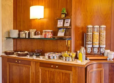 a kitchen with a counter with food on it at Best Western Hotel Astrid in Rome