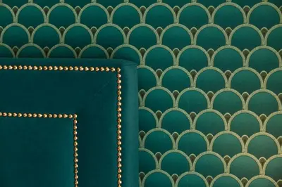 a wall with a green and gold wallpaper at Seven Suites in Rome