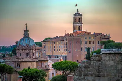 an old building with a clock tower on top of it at Aenea Inn in Rome