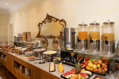 a buffet with many different types of food and drinks at Alpi Hotel in Rome