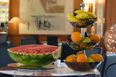 two bowls of fruit sitting on a table at Grand Hotel Tiberio in Rome