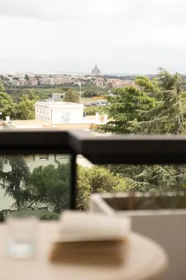 a hotel room with two beds with white sheets at Hotel Pineta Palace in Rome