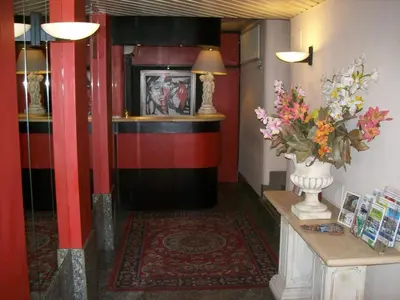 a hallway with a vase of flowers on a table at Hotel Prati in Rome
