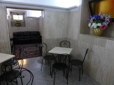 a room with tables and chairs and a couch at Hotel Prati in Rome