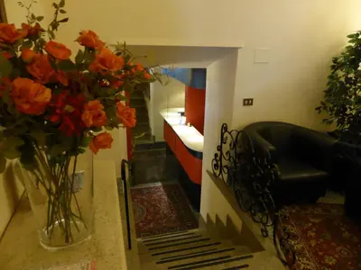 a room with a vase of flowers on a table at Hotel Prati in Rome