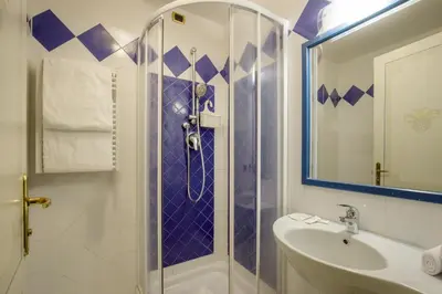 a bathroom with a shower and a sink at Hotel Alessandrino in Rome