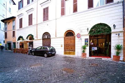 a car parked in front of a building at Vetrina Holidays Apartment Navona in Rome