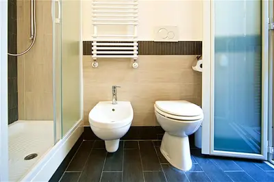 a bathroom with a toilet and a sink and a shower at Vetrina Holidays Apartment Navona in Rome