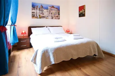 a bedroom with a bed with two towels on it at Vetrina Holidays Apartment Navona in Rome