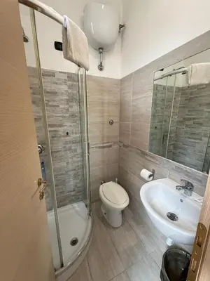 a bathroom with a toilet and a sink at Viennese Due in Rome