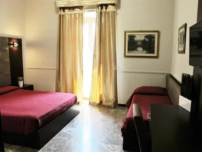 a hotel room with a bed and a window at Hotel d'Este in Rome