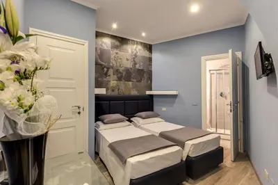 a bedroom with two beds in a room at Residenza Belli Inn in Rome