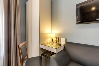 a room with a couch and a table with a lamp at Residenza Belli Inn in Rome