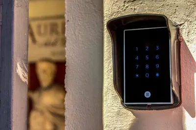 a clock on the side of a wall at Hotel Aurelius in Rome