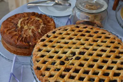 a table with two pies and a waffle at BeYou Hotel Ponte Milvio in Rome