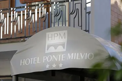 a sign for a hotel pomorie milmo at BeYou Hotel Ponte Milvio in Rome