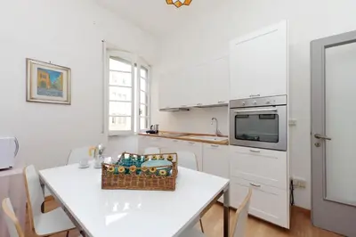 a kitchen with a table with a basket on it at 4BNB - Chinotto Spacious Apartment in Rome