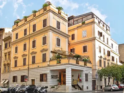 a large building with motorcycles parked in front of it at Hotel Museum in Rome