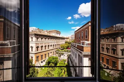 a view of a city from a window at Al Manthia Hotel - Gruppo Trevi Hotels in Rome