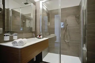 a bathroom with a sink and a shower at Hotel Trevi - Gruppo Trevi Hotels in Rome