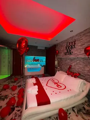 a bedroom with a bed with a red ceiling at Er Centurione in Rome